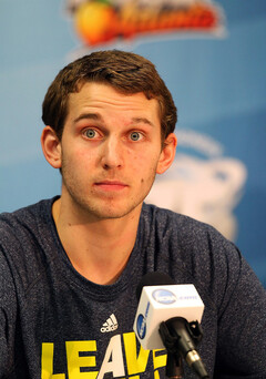 Nik Stauskas (11) of the Michigan Wolverines looks on during the Final Four interviews.