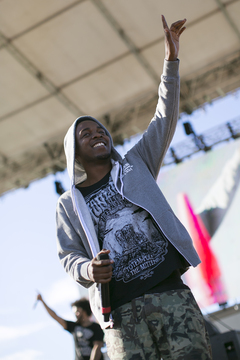 Lamar points to the sky after a successful set.