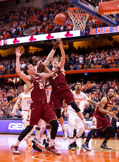 Christmas goes up for a layup in between two defenders. He scored 12 points on 5-of-8 shooting. 