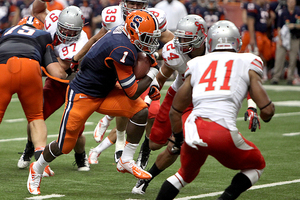 Ashton Broyld rushes up the middle against Stony Brook on Saturday. The freshman running back finished with 61 yards on the ground and scored his first career touchdown.