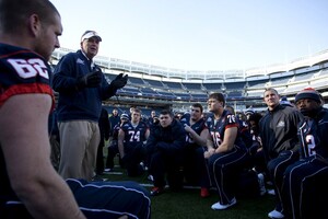 Syracuse head coach Doug Marrone speaks to his players and children from the Kips Bay Boys and Girls Club. 