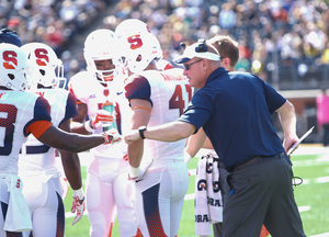 Syracuse head coach Scott Shafer celebrates with his team during his team's 30-7 win over Wake Forest on Saturday afternoon. 