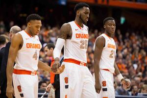 Rakeem Christmas, had a career-high 35 points, low-fives Ron Patterson as they walk onto the court during Syracuse's overtime victory over Wake Forest on Tuesday. 