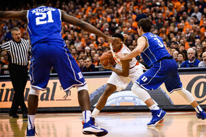 SU sophomore guard Ron Patterson gets set in the triple-threat position against Duke guard Grayson Allen on Saturday night. The Orange led at half, but ultimately fell to the Blue Devils, 80-72, at the Carrier Dome.