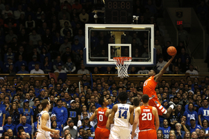 Tyler Roberson throws down an alley-oop against the Blue Devils on Monday night at Cameron Indoor Stadium. He finished with 20 rebounds on the night in the Orange's marquee win of the season.