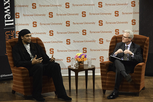 Etan Thomas discussed athletes and social activism with Grant Reeher, director of the Campbell Public Affairs Institute, in Hendricks Chapel on Monday night.