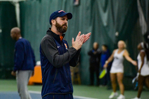 Len Lopoo, a volunteer assistant coach for SU, is a big part of the Orange's afternoon practice sessions.