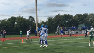 Jaiquawn McGriff (No. 6) celebrates one of his two rushing scores for Cicero-North Syracuse on Saturday.