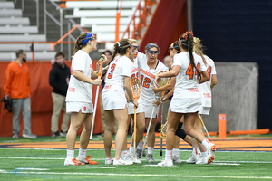 Syracuse celebrates following a goal in SU's loss to No. 1 Boston College on Saturday.