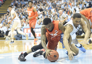 Frank Howard dives for a ball on the ground in Syracuse's matchup with North Carolina on Tuesday.