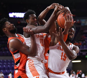 Alan Griffin battles for a rebound surrounded by Clemson players during Syracuse's 78-61 loss.