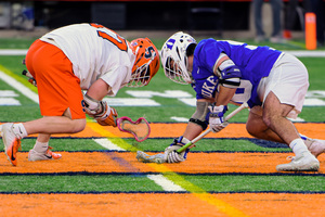 Jakob Phaup, Syracuse's faceoff specialist, is coached by TD Irelan, the NCAA’s all-time faceoff leader.