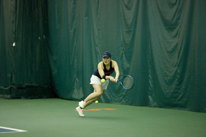 Miyuka Kimoto races to return a ball against Duke's Emma Jackson. Kimoto lost to Jackson in the No. 3 singles match 6-3, 6-1