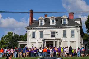 During Monday's SEIU rally, Syracuse University workers gather in front of 727 Comstock Ave. to protest pay wages and treatment in the workplace. Workers chose this location to critique the university's recent spending on campus infrastructure development efforts.