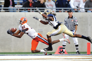 Van Chew (82) hauls in a 26-yard touchdown pass from Ryan Nassib right before the half. The score was a key turning point in the win, as it gave SU a 14-point lead at the break.