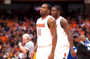 Scoop Jardine (11) and Rick Jackson walk off the court during Syracuse's 90-68 loss Tuesday to Seton Hall.