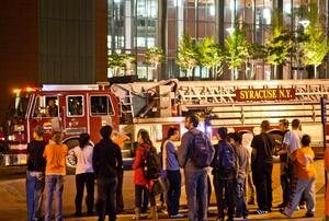 Students wait outside the Life Sciences Complex while officials work to reset the ventilation system.