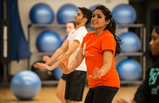 Junior Jaspreet Kaur, co-captain of the Orange Bhangra dance team, leads a group of new dancers into the team's dance routine at the Ernie Davis dance studio.