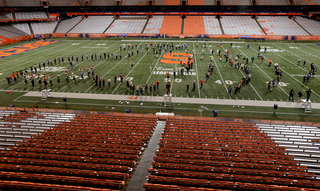 The SU Marching Band practices in the Carrier Dome.