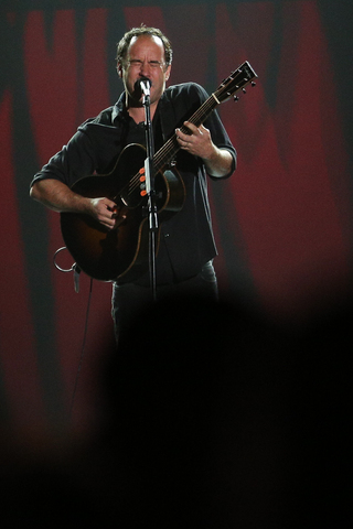 Dave Matthews performs on stage.