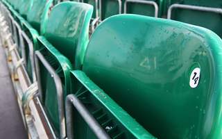 The reflection of the ship is seen in seat number 14 in the bleachers aboard the USS Midway Museum on Nov. 8, 2012, before the Battle on the Midway game between the Syracuse Orange and the San Diego State Aztecs scheduled for Sunday.