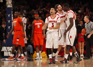 Louisville players celebrate as they begin to pull ahead in second half.