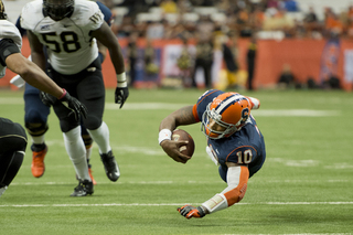 Terrel Hunt dives into the end zone, using his left arm to brace his fall.