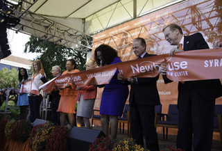 Members of the SU community and special guests gather on stage for the ribbon cutting ceremony at the Dick Clark Studios and Alan Gerry Center for Media Innovation.