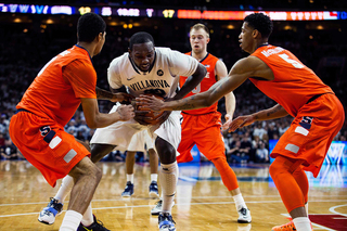 Gbinije and McCullough hound around the ball as they try to create a first-half turnover. 