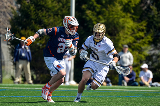 Nick Mariano runs past a UND player. He had four goals. 