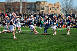 SU players stream from the sidelines to celebrate the win. 