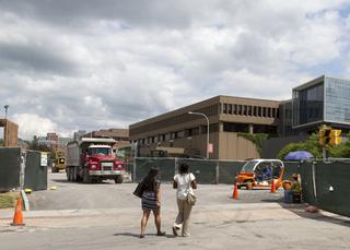 Traffic on Waverly Avenue is being routed onto South Crouse Avenue through a makeshift intersection to bypass the sewer line construction along the street in front of the Newhouse Complex. Photo taken by July 11, 2017