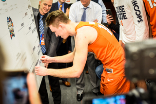 Bayer had the honors of putting up Syracuse's sticker on the bracket. Battle did that on Wednesday and Marek Dolezaj had the job on Friday. 