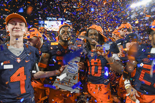 Blue and Orange confetti rained down on SU after they won their first bowl game since 2013 against former Big East foe, West Virginia. 