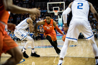 Oshae Brissett drives in with his left hand. In the absence of Tyus Battle, Brissett was more aggressive offensively.