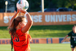 Freshman Kailey Brenner looks to throw the ball to a teammate during the match against Siena.